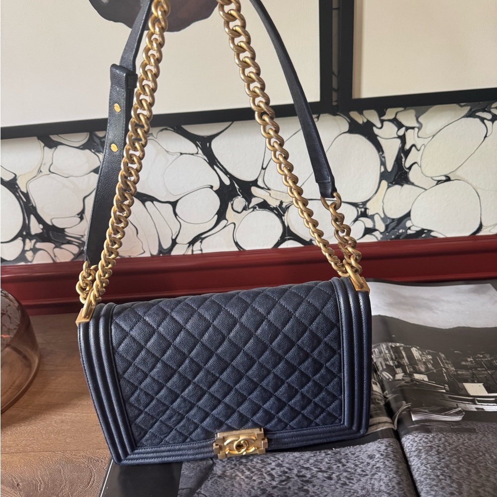 Navy blue Chanel boy bag.